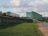 Nyugalmasabb idõkben hetente 3 napon 1-2 vonatpár eljut Lengyelországból Litvániába, itt a Bialystok felé tartó vonat kelt át éppen a Nyeman (Nemunas) folyó hídján Kaunasnál